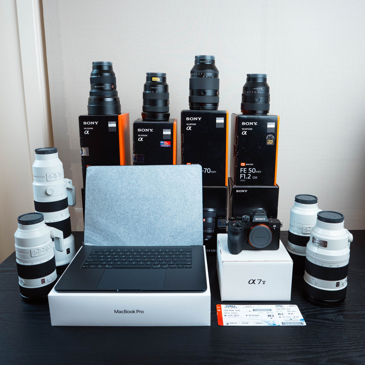 Two Sony camera bodies, two G Master lenses and two MacBook Pros, boxed