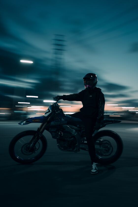 Rider on a motorbike at dusk, edited with North Borders presets
