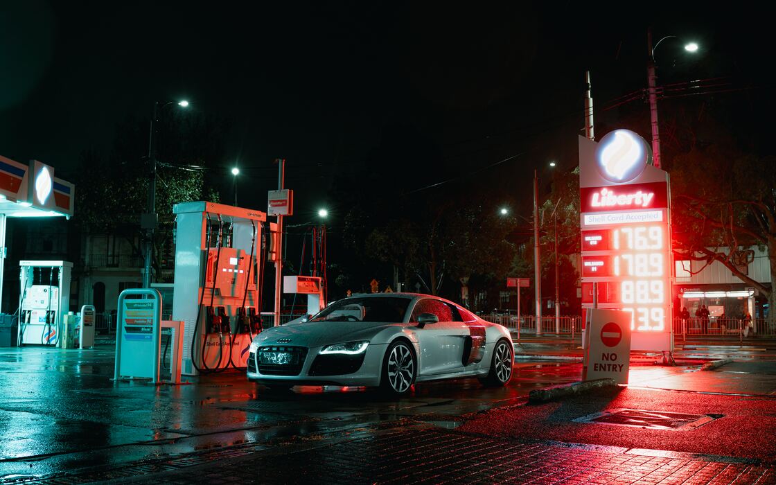 Sports car on a wet forecourt at night, edited with North Borders presets