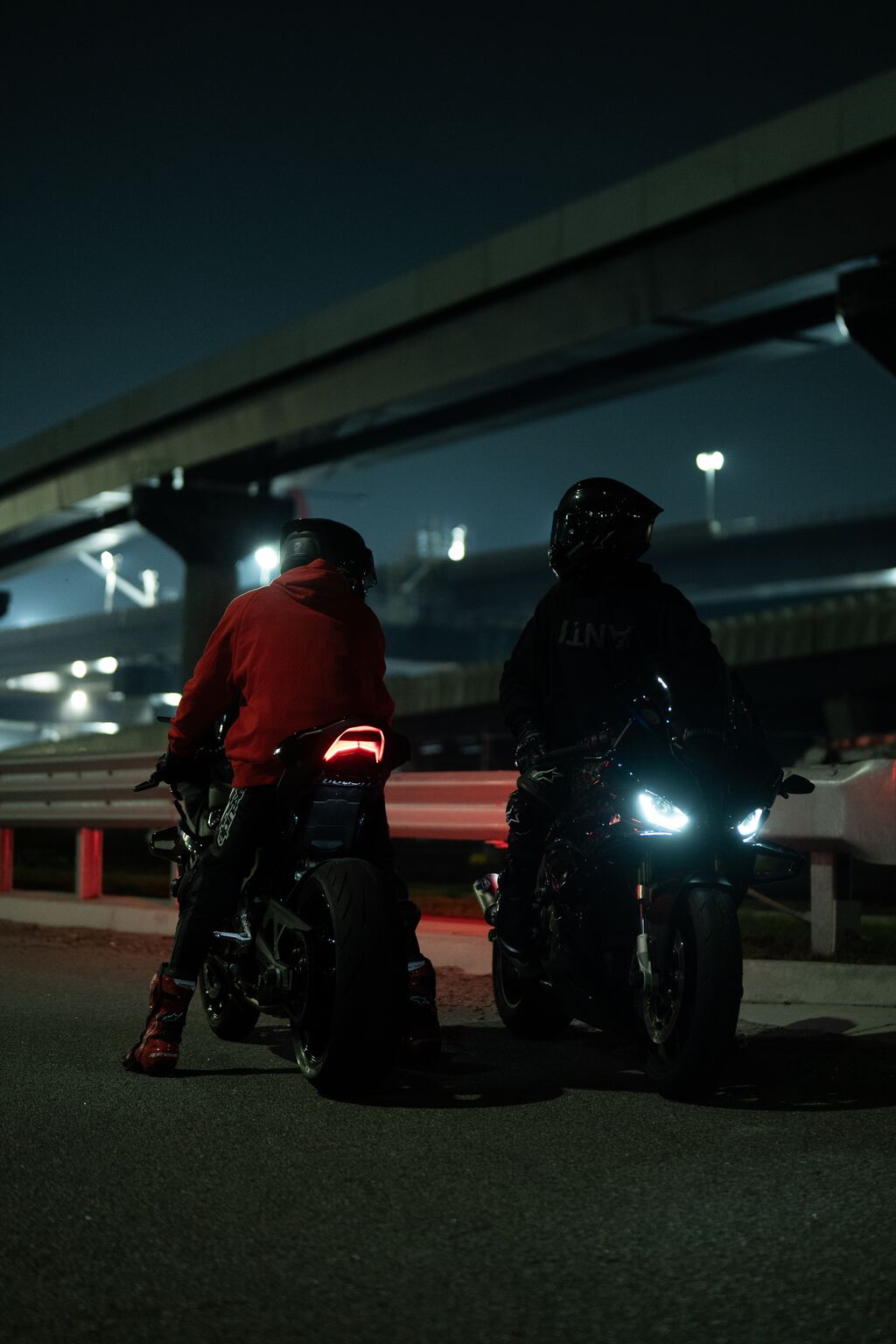 The same shot of two riders under an overpass, unedited straight out of camera